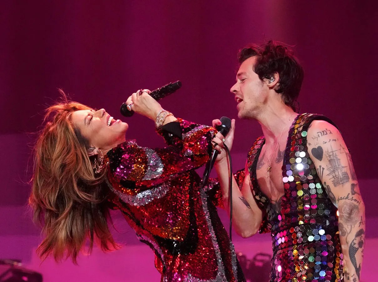 Two performers sharing the stage at a major music festival